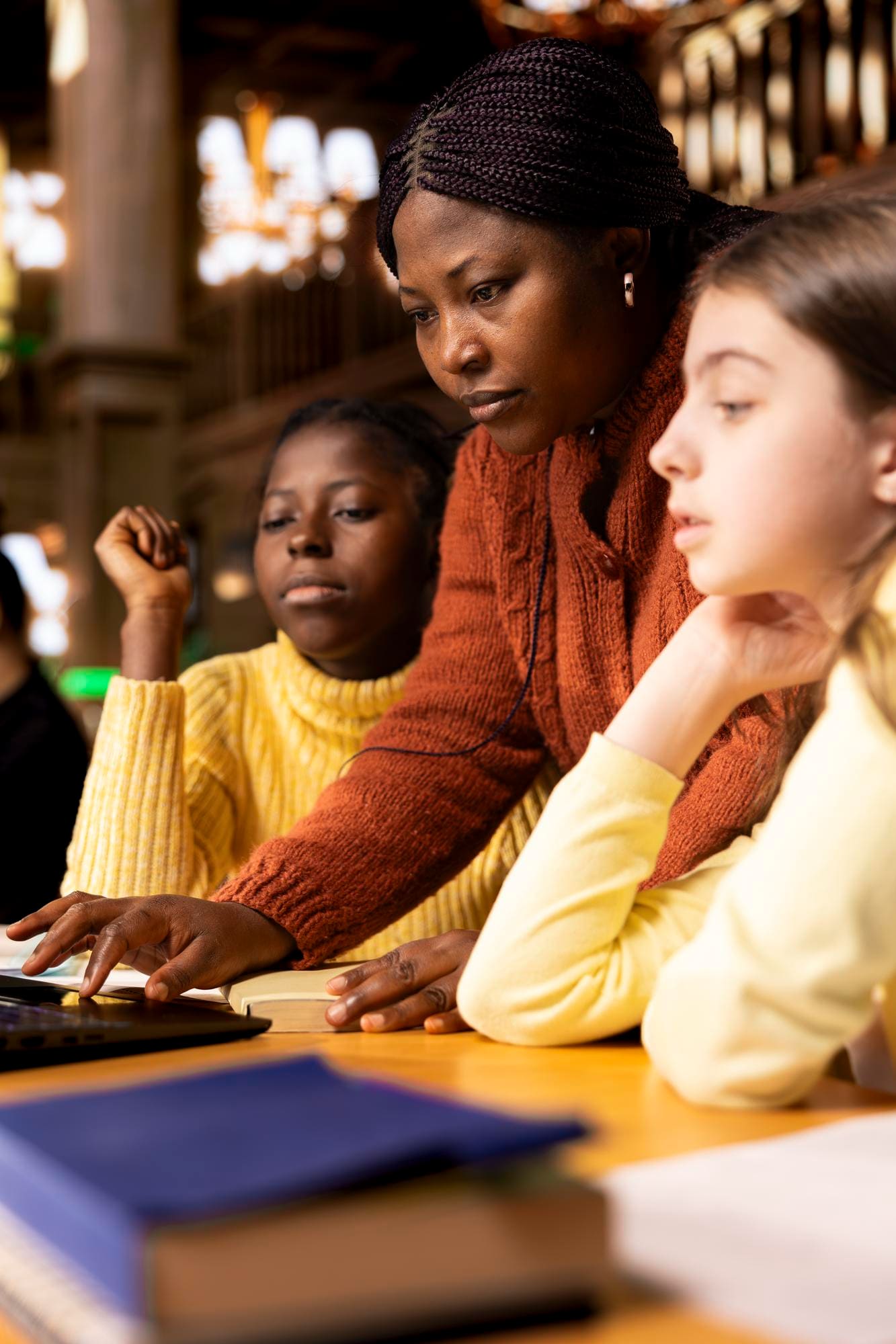Support worker helping a young person study